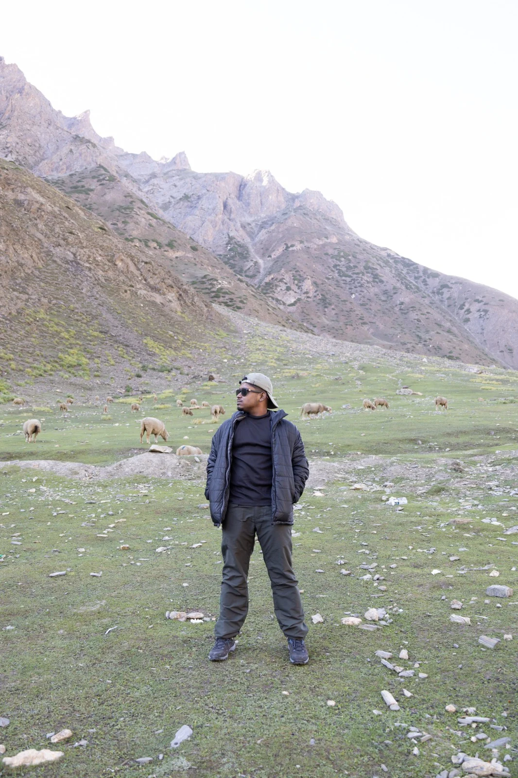 Anirban standing in a Himalayan valley at dusk